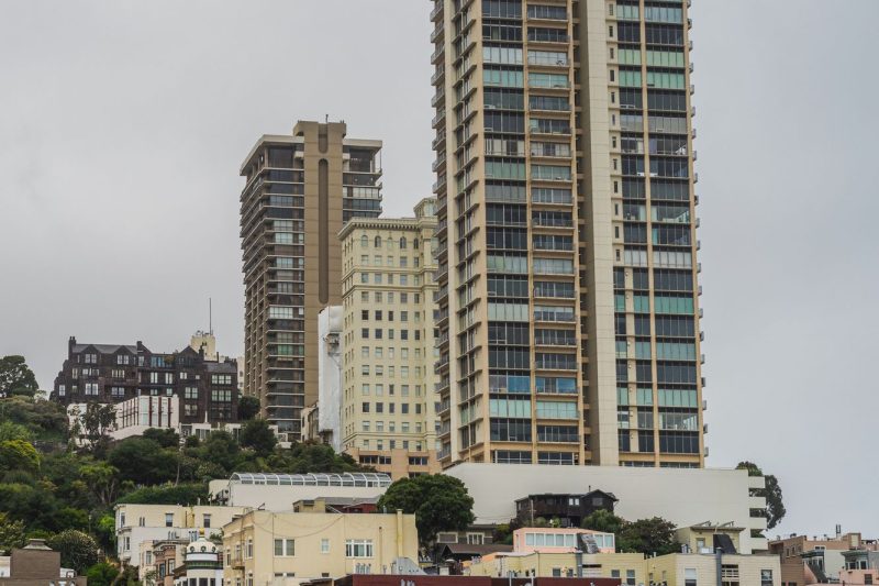 San Francisco cityscape with modern residential towers and diverse architectural styles under a clear sky.